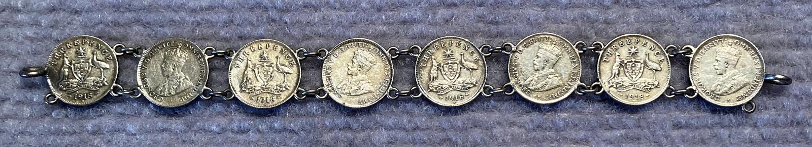 Other side of WWI era trench art coin bracelet