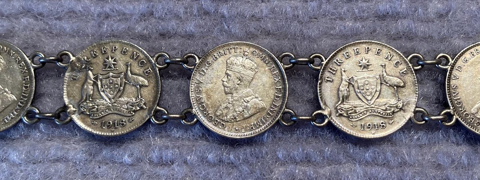 Close up of other side of WWI era trench art coin bracelet