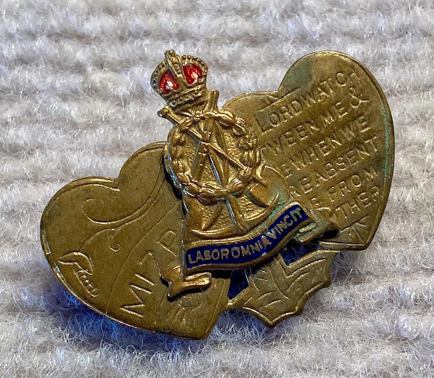 Angled view of WWI era Labour Corps Mizpah sweetheart brooch