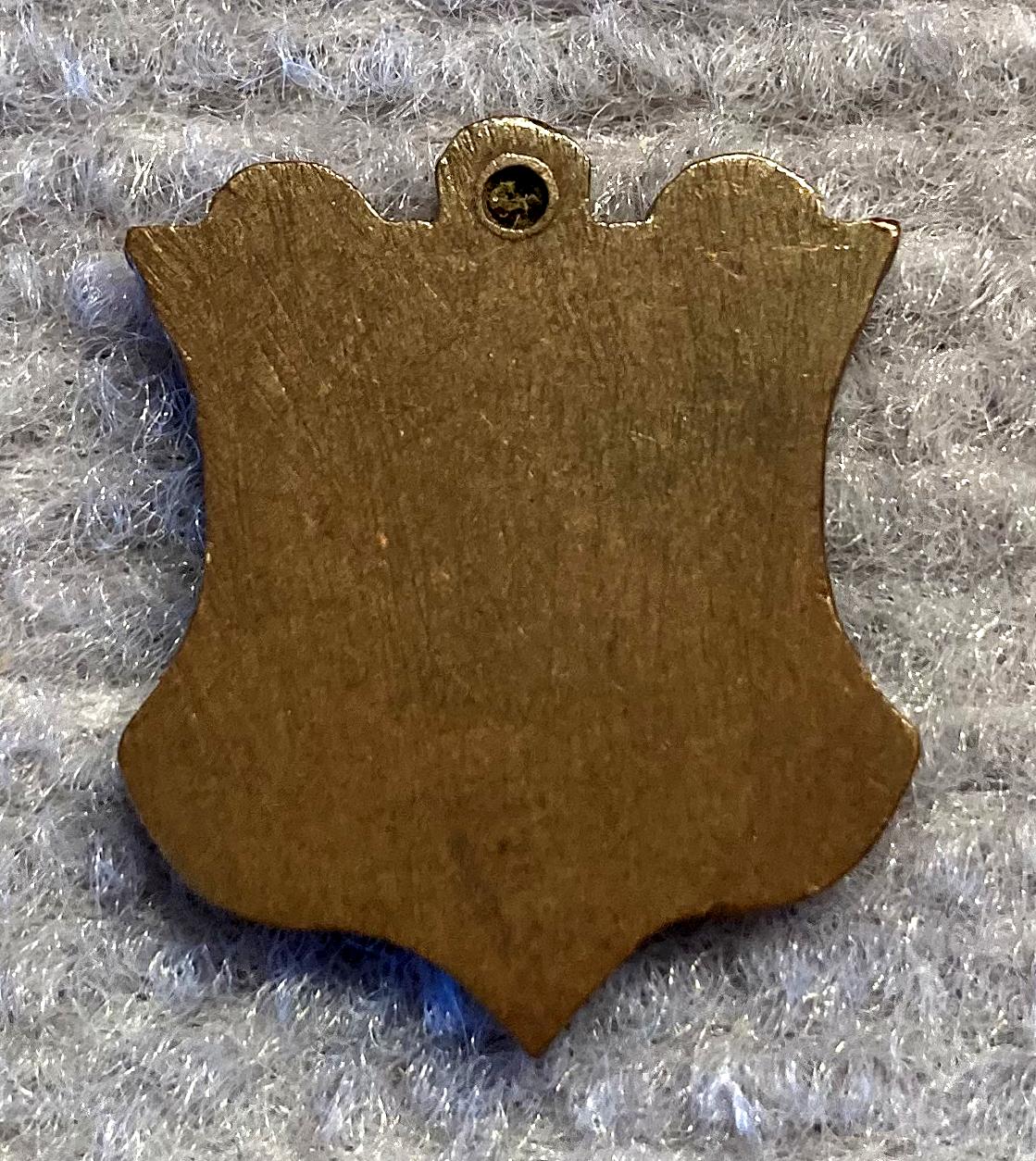 Reverse of gilded metal Mizpah sweetheart fob or pendant