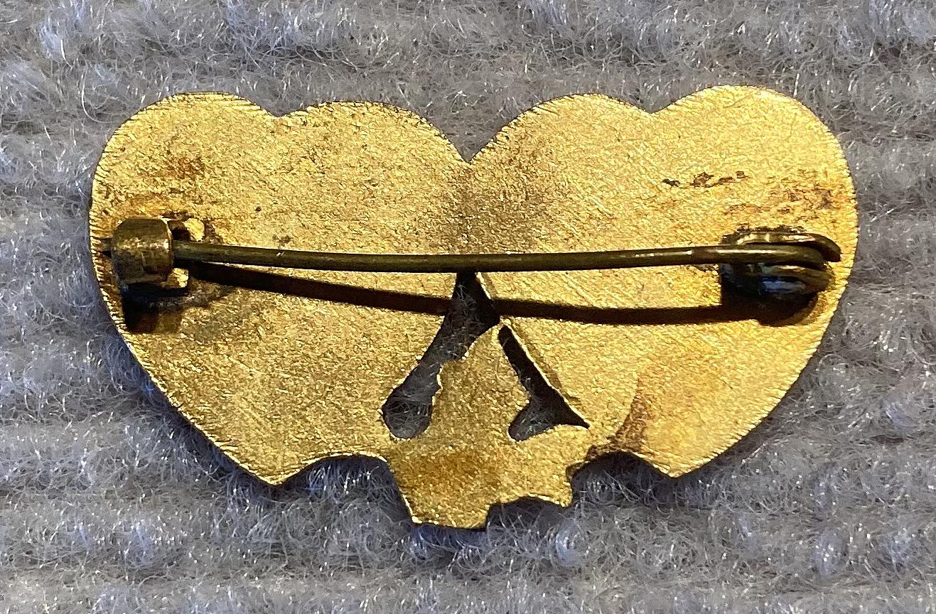 Reverse of Mizpah brooch with rising sun motif