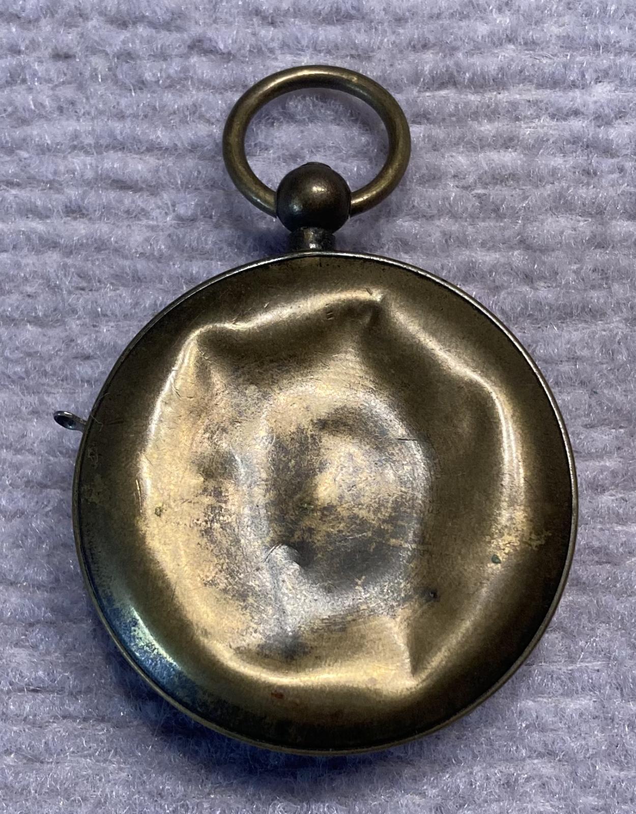 Reverse of mechanical dice game encased in a pocket watch housing