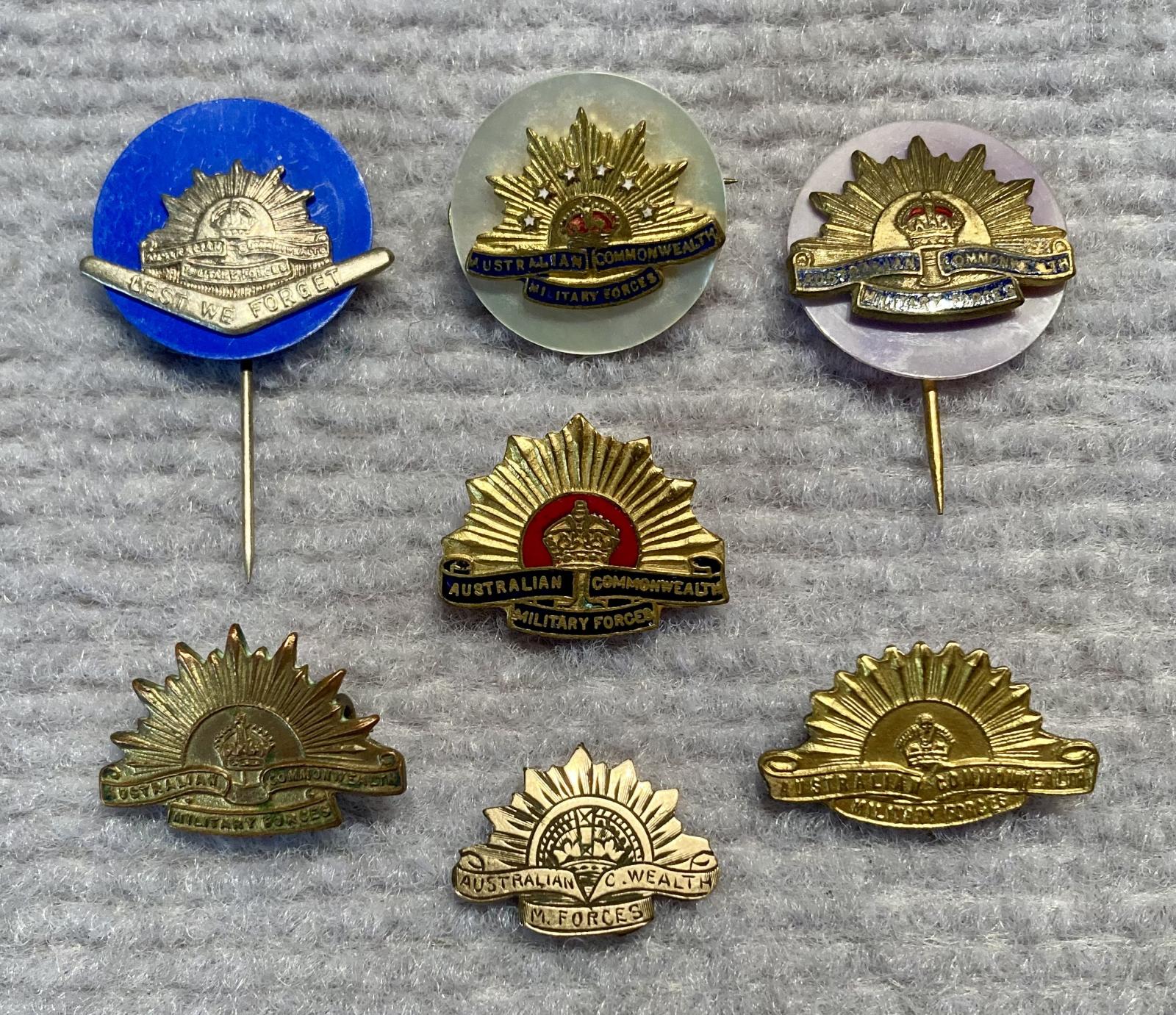 Group of miniature Rising Sun badge brooches and stick pins