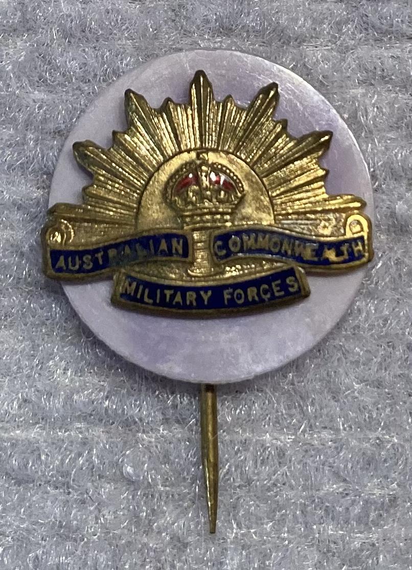 Miniature Rising Sun badge stick pin on lilac backing