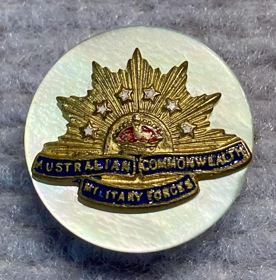 Miniature Rising Sun badge brooch with mother of pearl backing