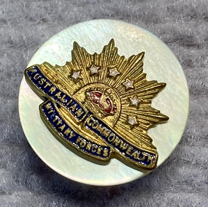 Other angled view of miniature Rising Sun badge brooch with mother of pearl backing