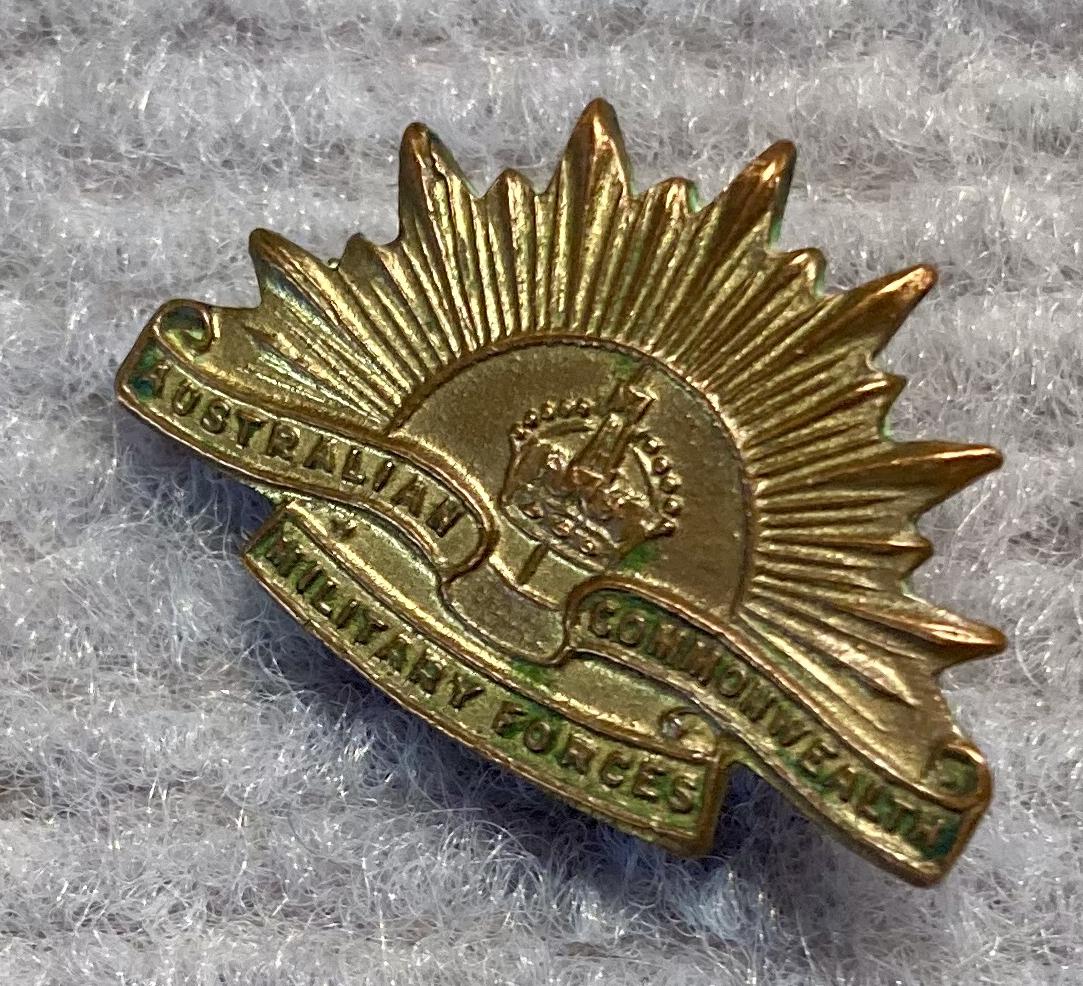 Other angled view of miniature Rising Sun badge gold tone metal brooch - 1