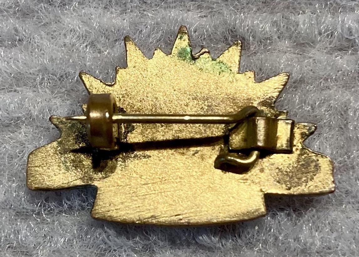 Reverse of miniature Rising Sun badge metal and enamel brooch
