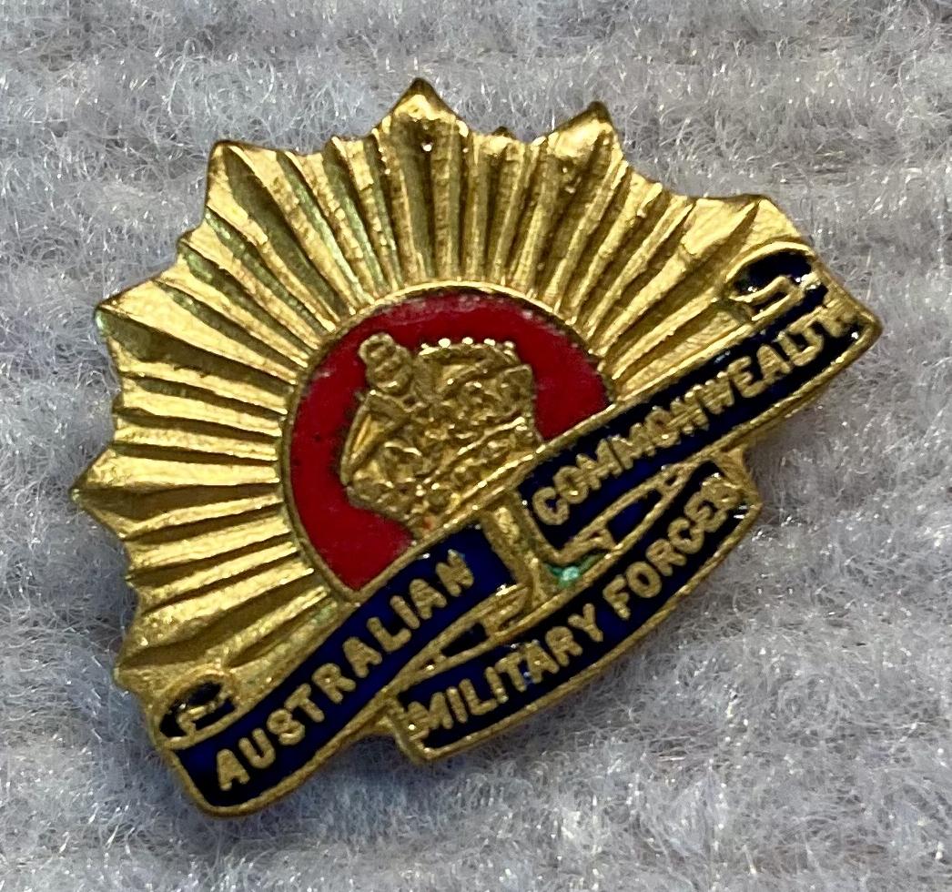 Angled view of miniature Rising Sun badge metal and enamel brooch