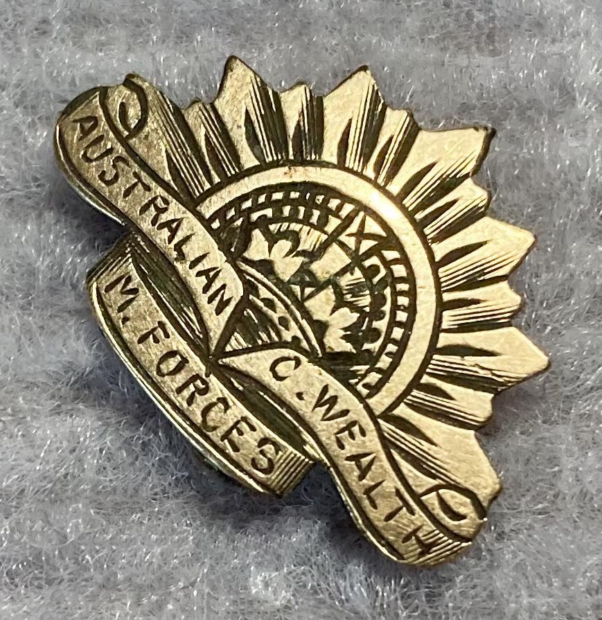 Other angled view of miniature Rising Sun badge engraved metal plaque