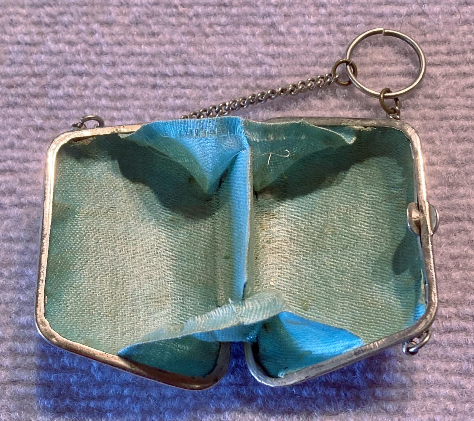 Side view of open souvenir metal ladies dance purse or chatelaine 