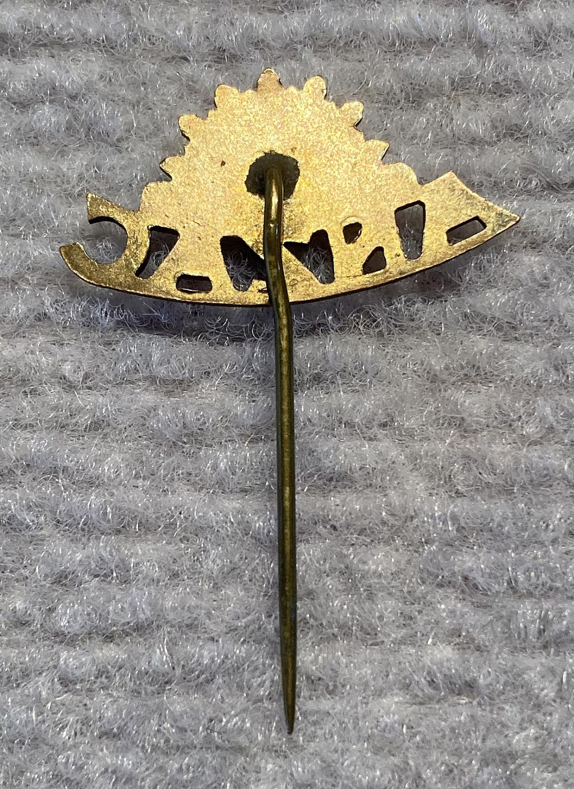 Reverse of WWI era brass and enamel ANZAC sweetheart stick pin