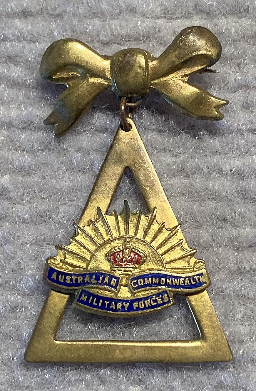Gold tone metal and enamel Rising Sun badge sweetheart brooch
