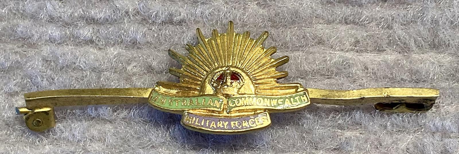 Gold tone metal and enamel Rising Sun badge sweetheart lapel brooch/tie pin