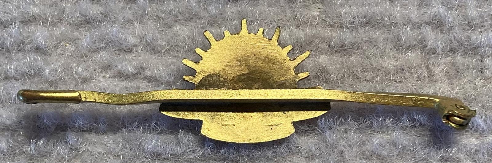 Reverse of gold tone metal and enamel Rising Sun badge sweetheart lapel brooch/tie pin