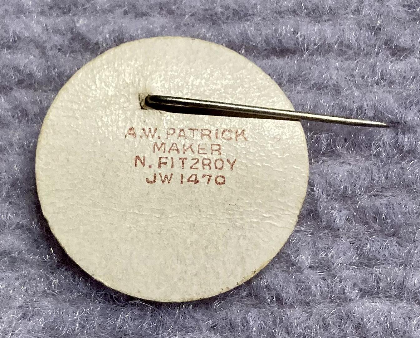 Reverse of 'Lord Mayors Fund Centenary Appeal' celluloid fundraising pin showing maker's details