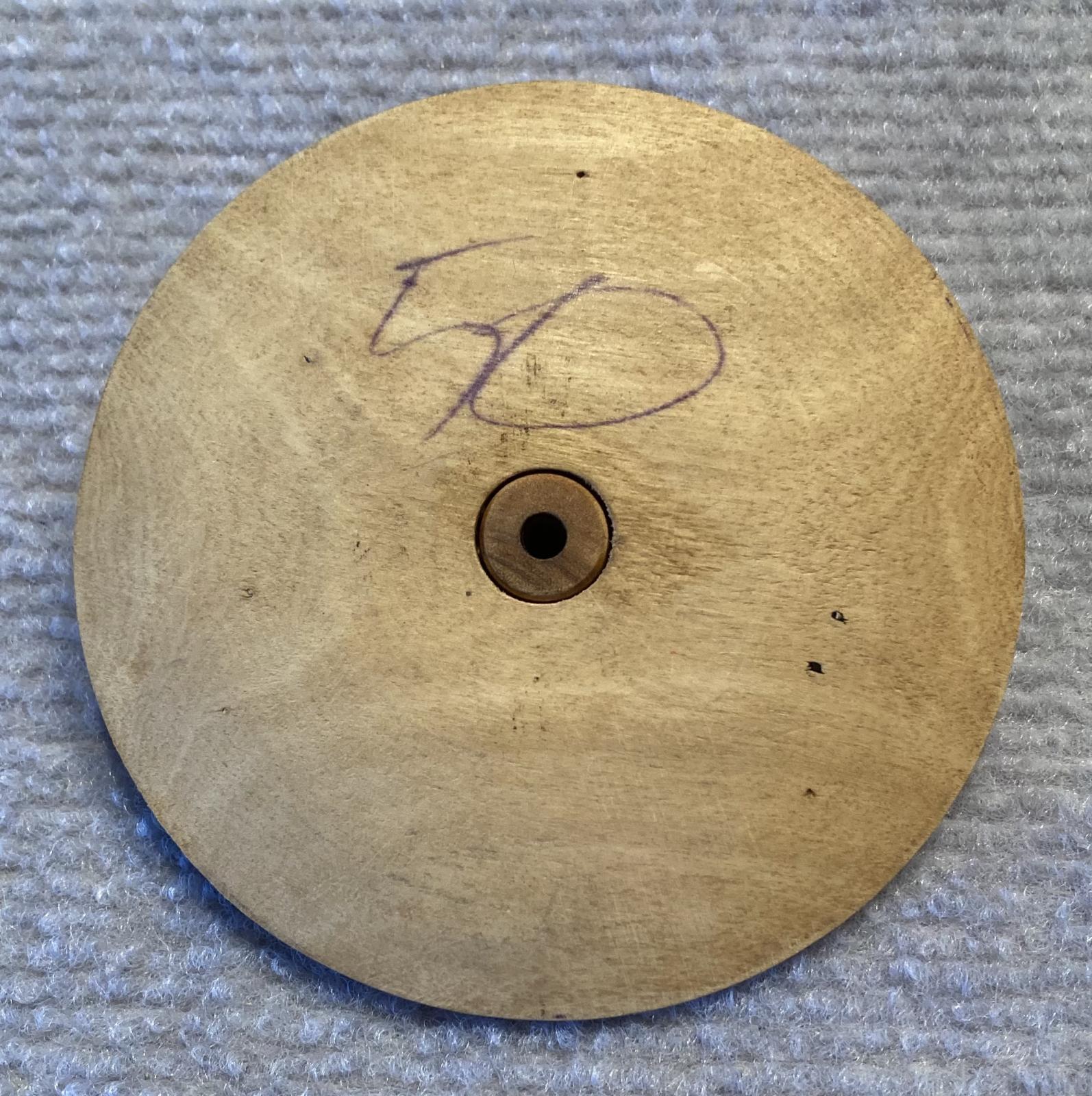 Trench art timber roulette wheel with Rising Sun badge - underside of wheel