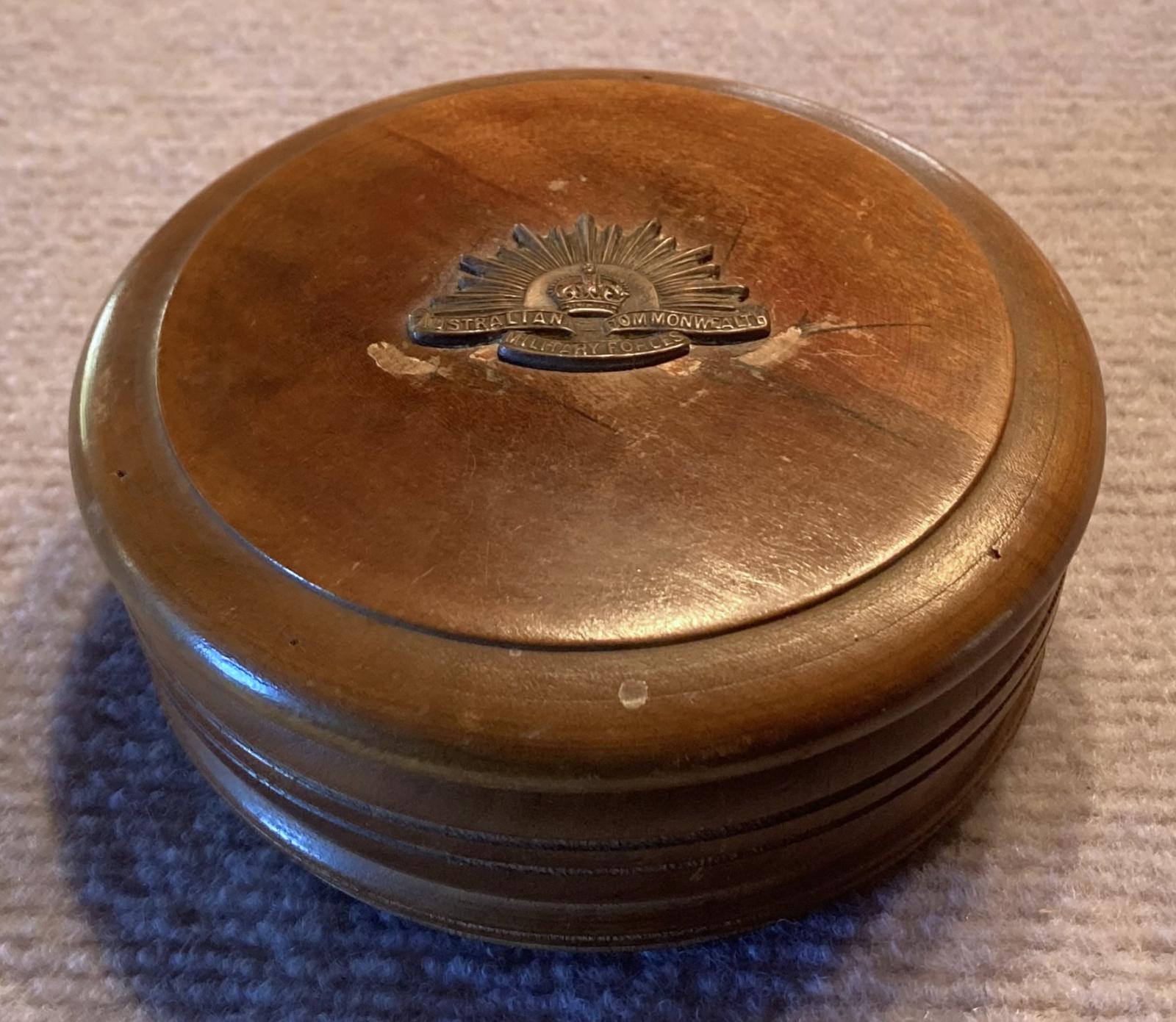 Trench art timber roulette wheel with Rising Sun badge - oblique view with lid on
