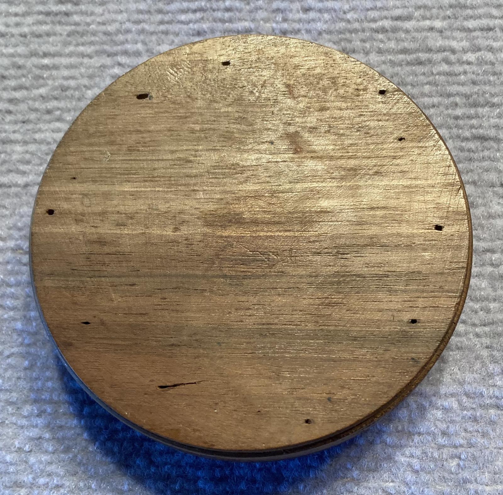 Trench art timber roulette wheel with Rising Sun badge - view of base