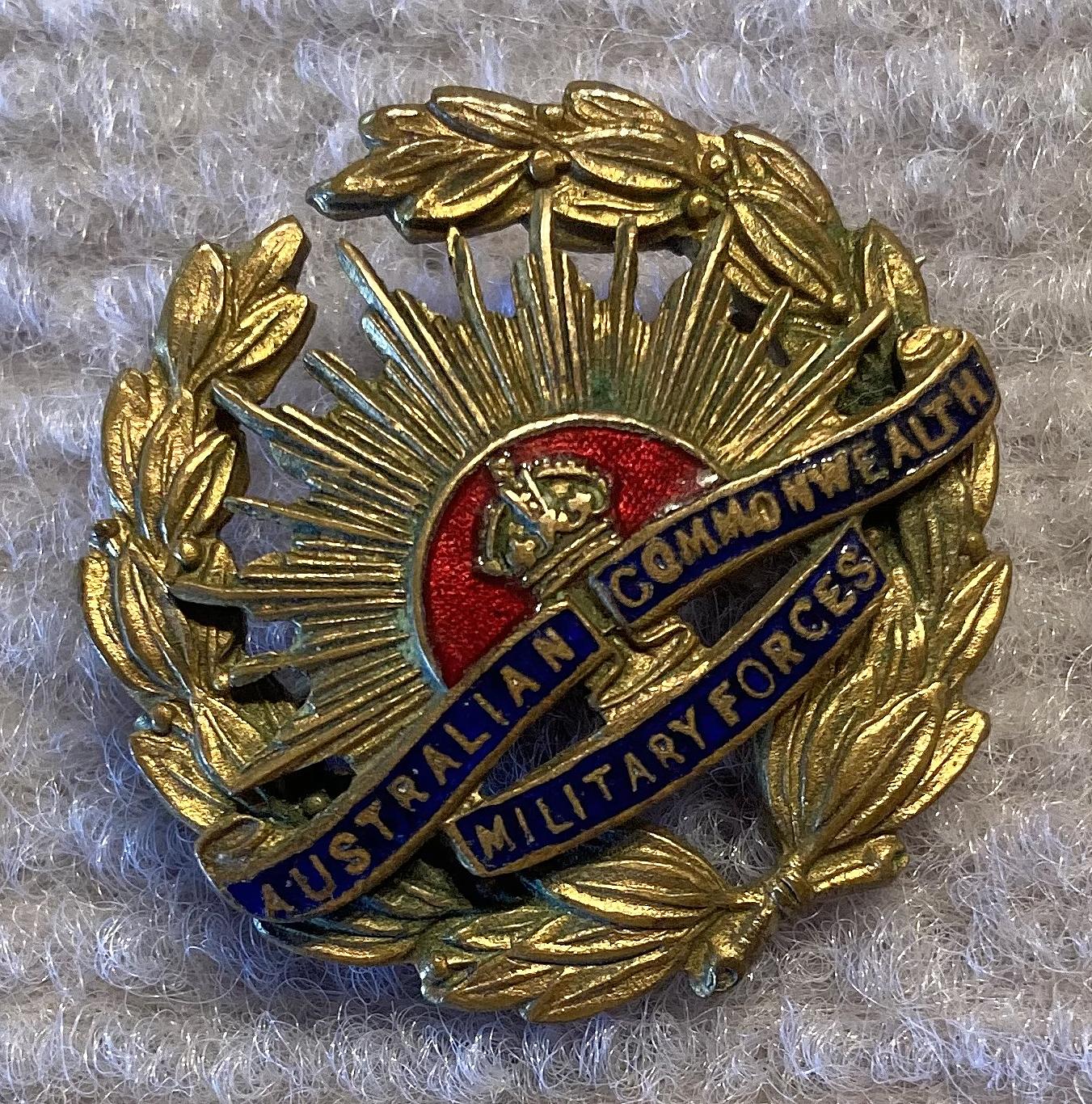Angled view of brass and enamel Rising Sun badge sweetheart brooch