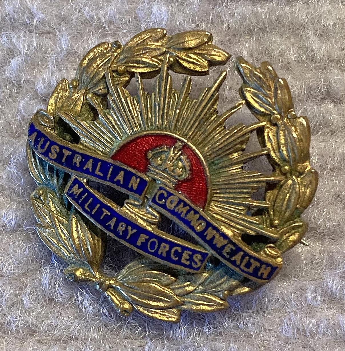 Other angled view of brass and enamel Rising Sun badge sweetheart brooch
