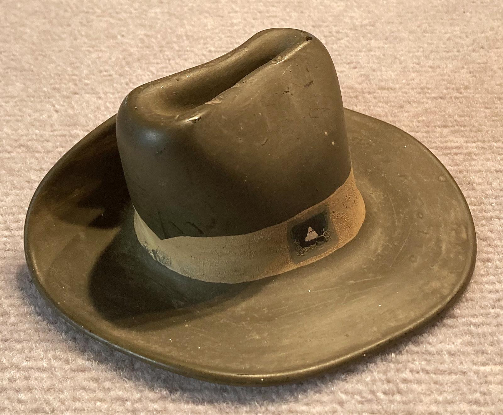Other oblique view of slouch hat made from melted milk bottle by Italian POW - Cowra