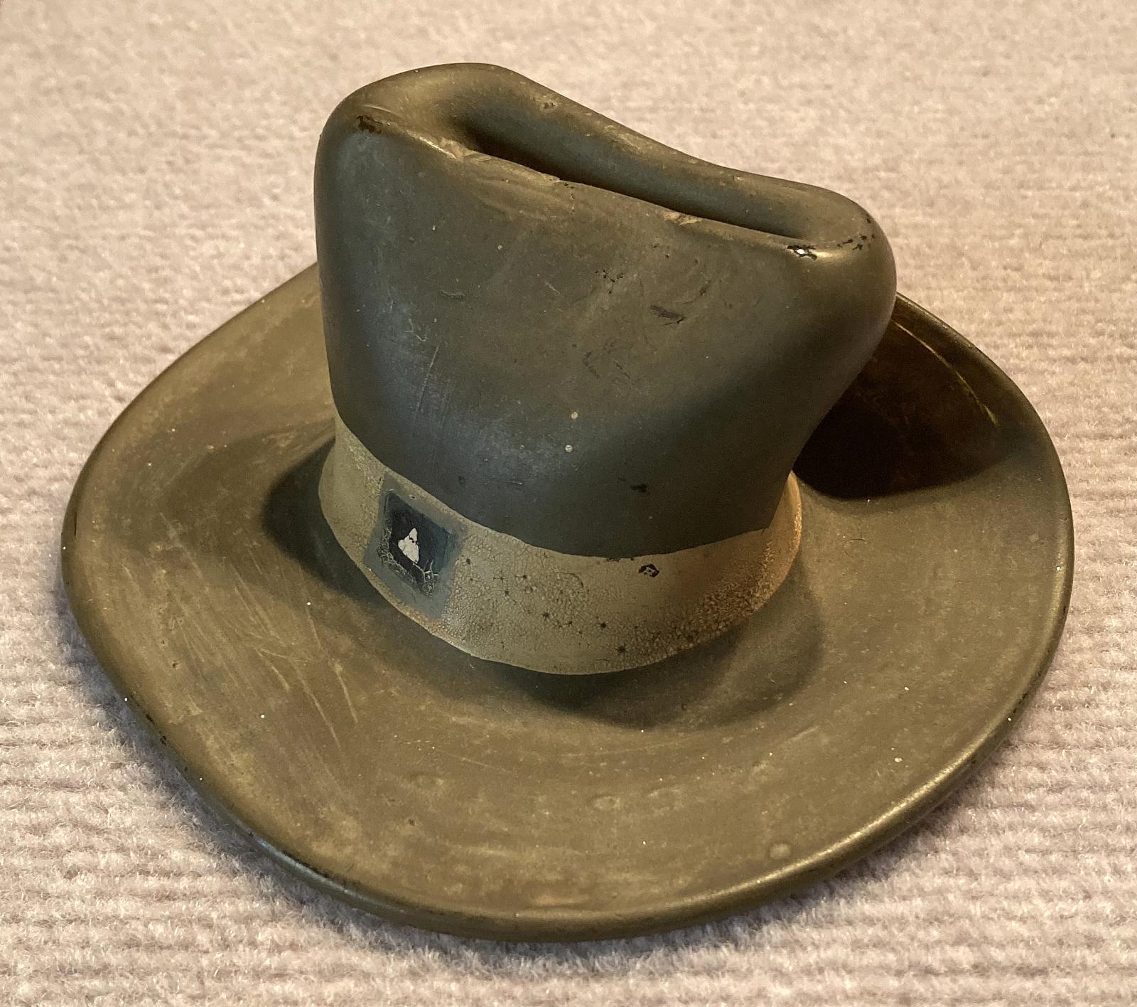 Oblique view of slouch hat made from melted milk bottle by Italian POW - Cowra