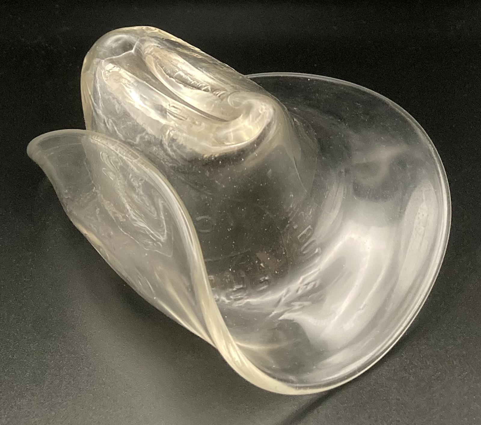 Oblique view of slouch hat made from melted milk bottle 