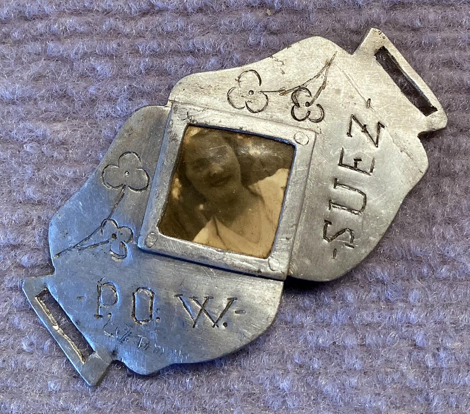 Angled view of trench art photo bracelet made by a Prisoner of War