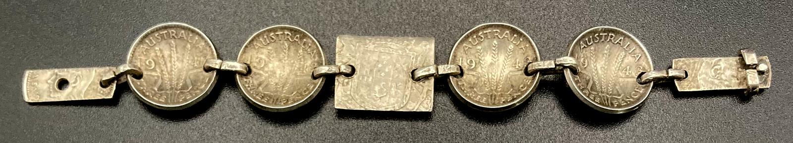 Reverse of WWII era trench art coin bracelet for child dated 1943