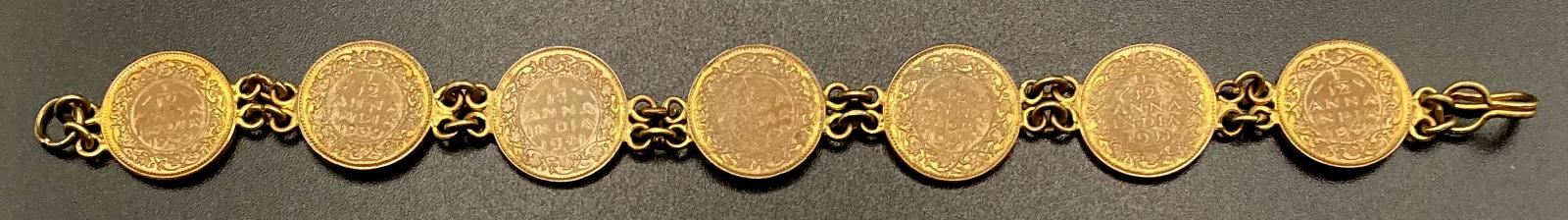 Reverse of WWII era trench art bracelet made from Indian 1/2 Anna coins