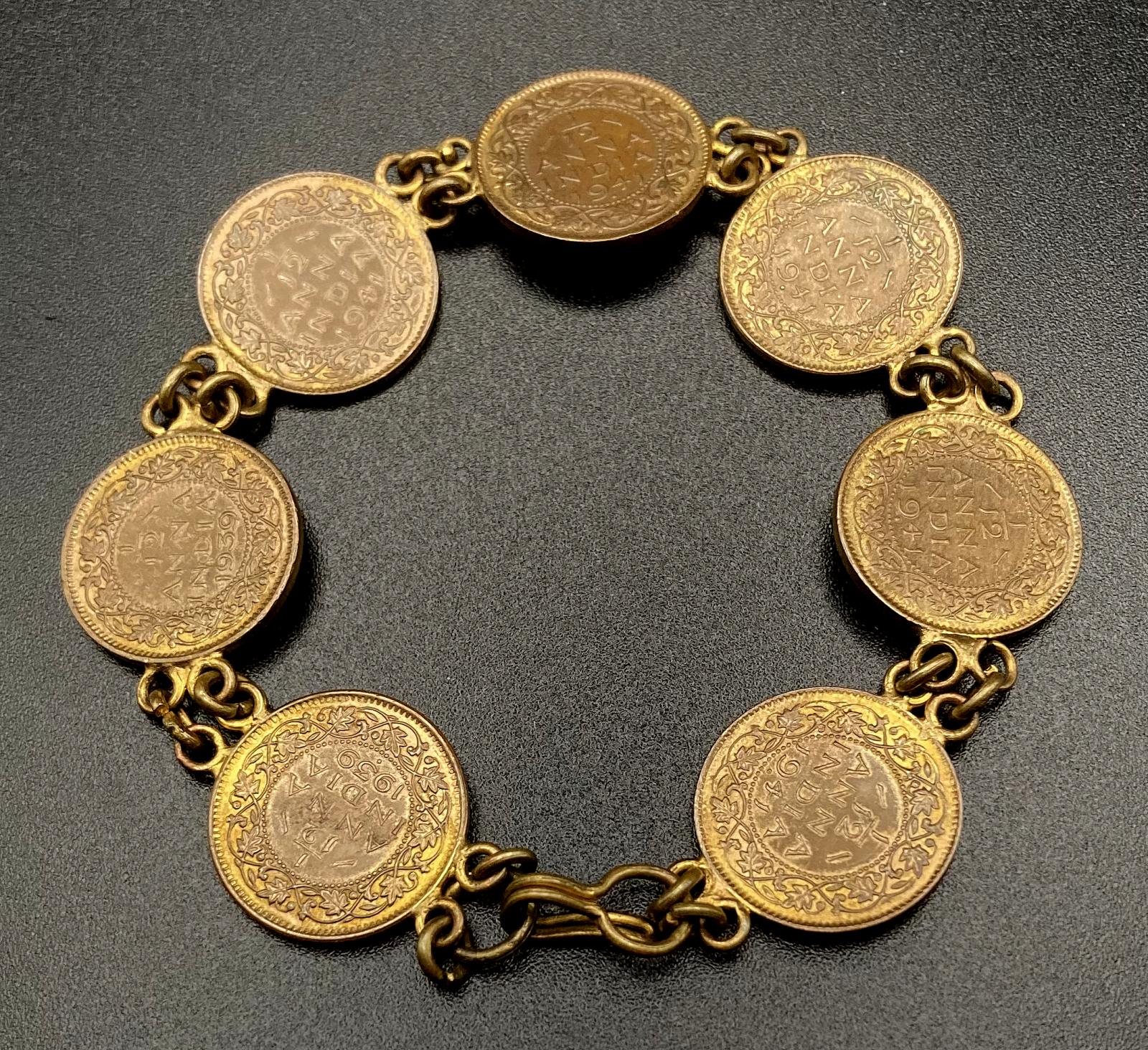 WWII era trench art bracelet made from Indian 1/2 Anna coins with clasp closed