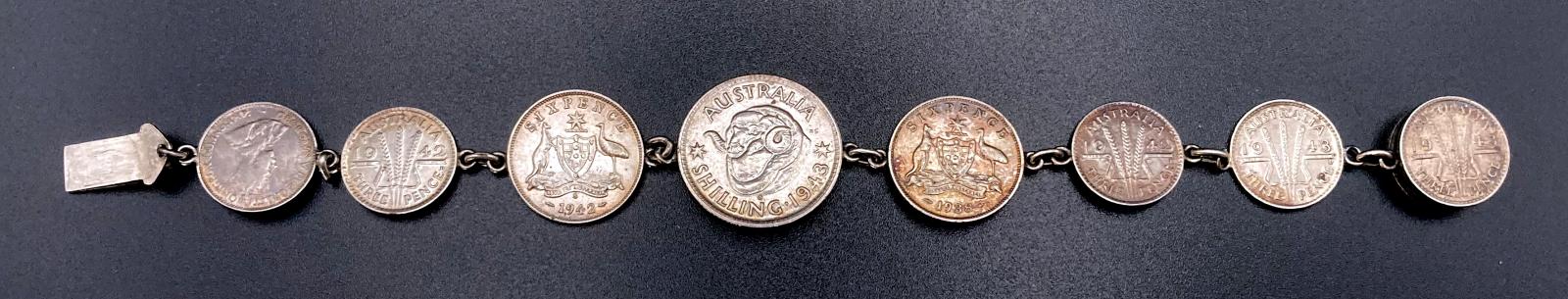 Reverse of WWII era trench art coin bracelet given to Ethel by Eileen and John