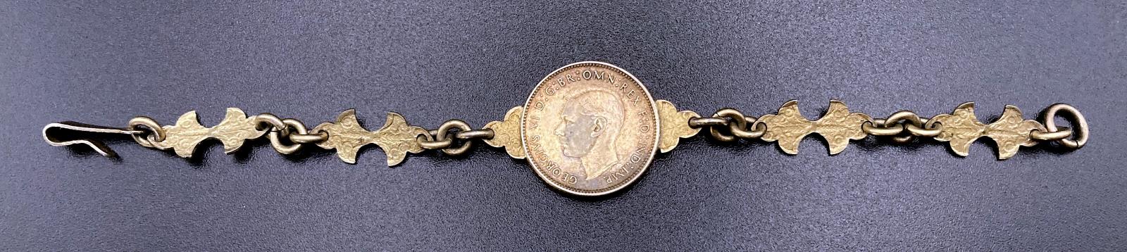 Reverse of WWII era trench art gilded coin bracelet for child dated 1943 