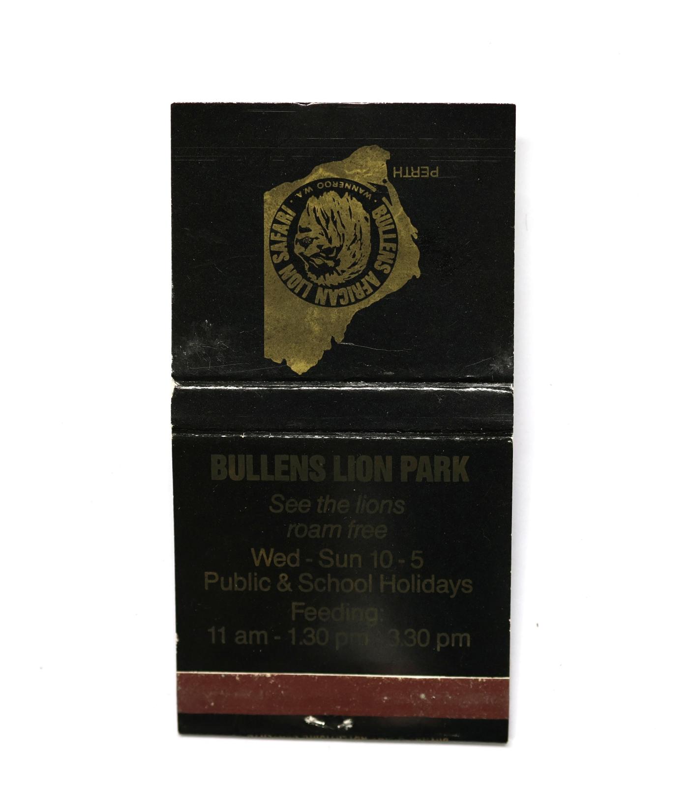Square shaped matchbook, black background with gold image and text. The back of the matchbook has a brown igniting panel. 