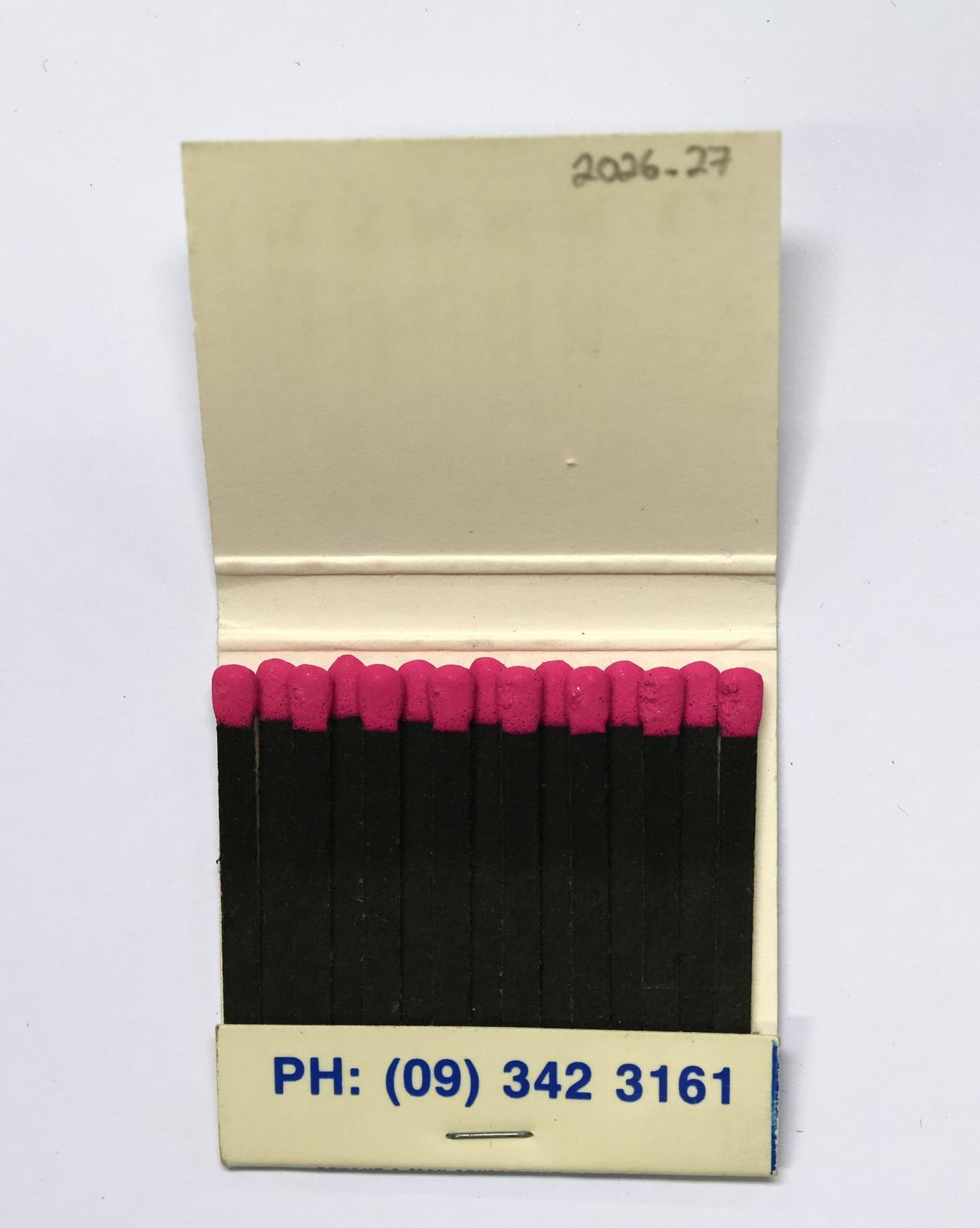 The inside has 15 black matchsticks with pink match heads.  