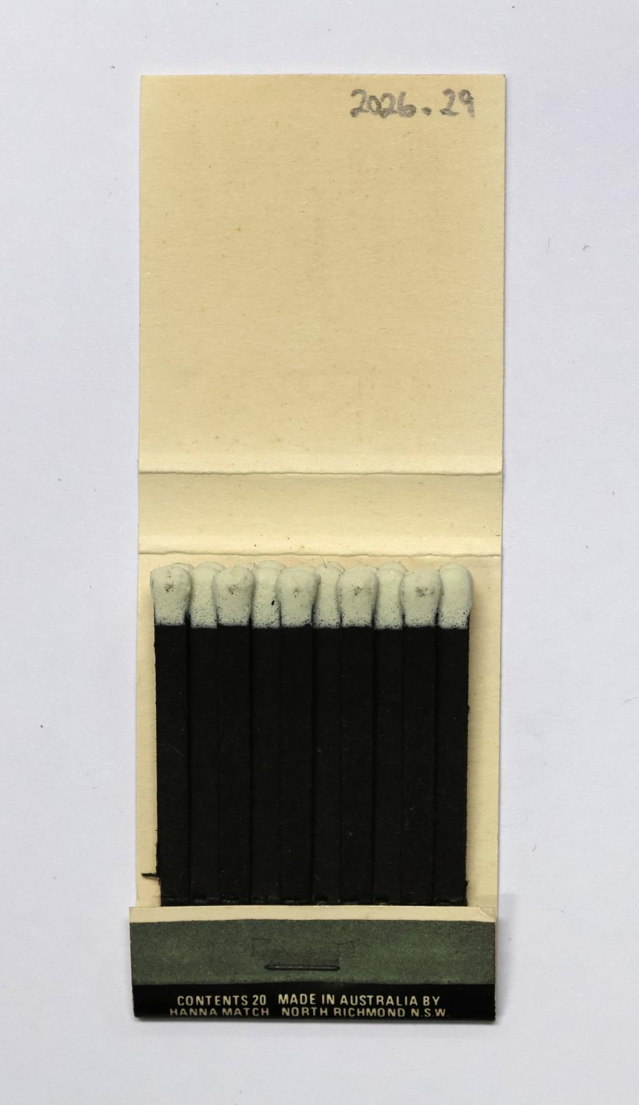 The inside has 20 black matchsticks with white match heads.