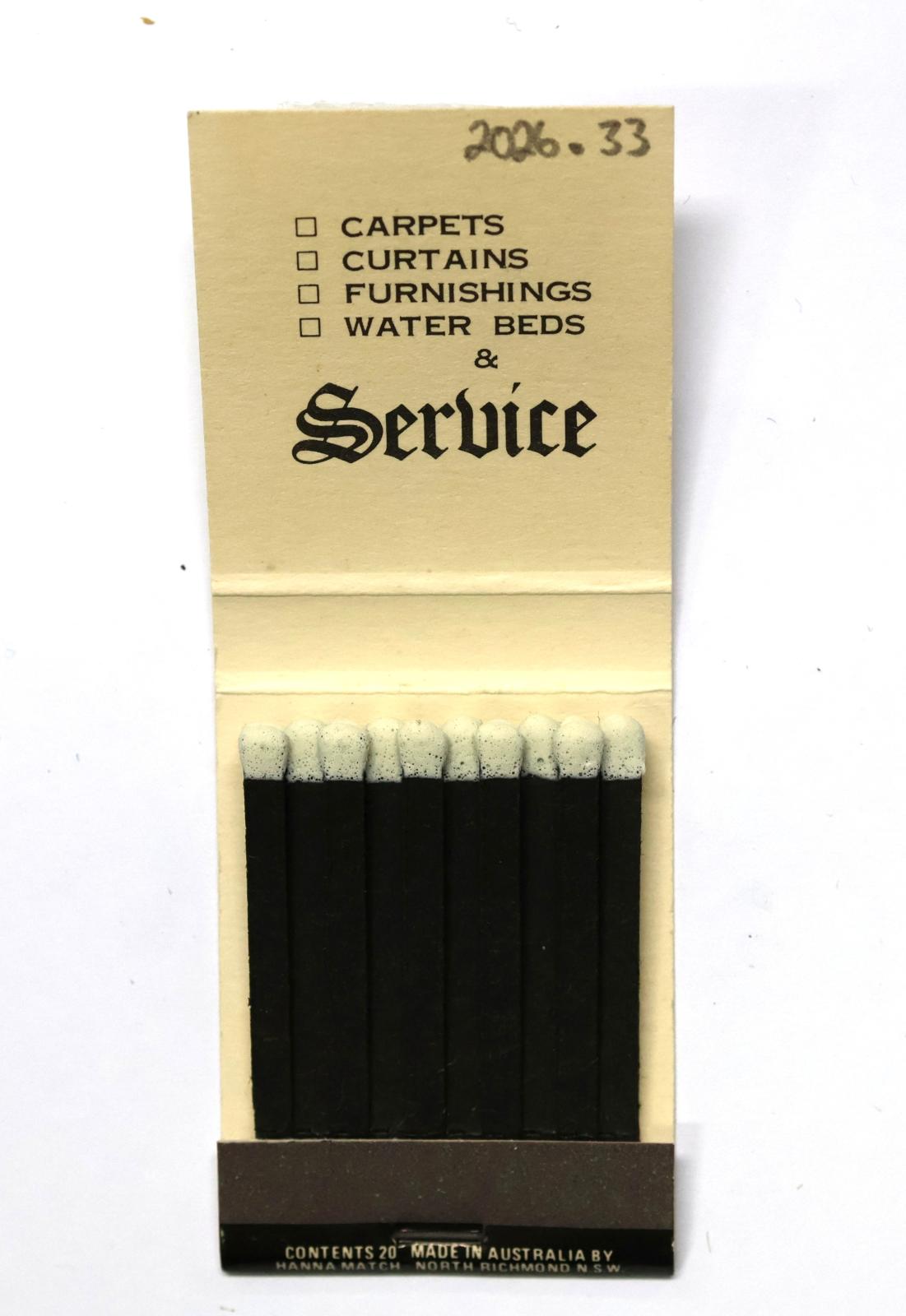 The inside has 20 black matchsticks with white match heads.