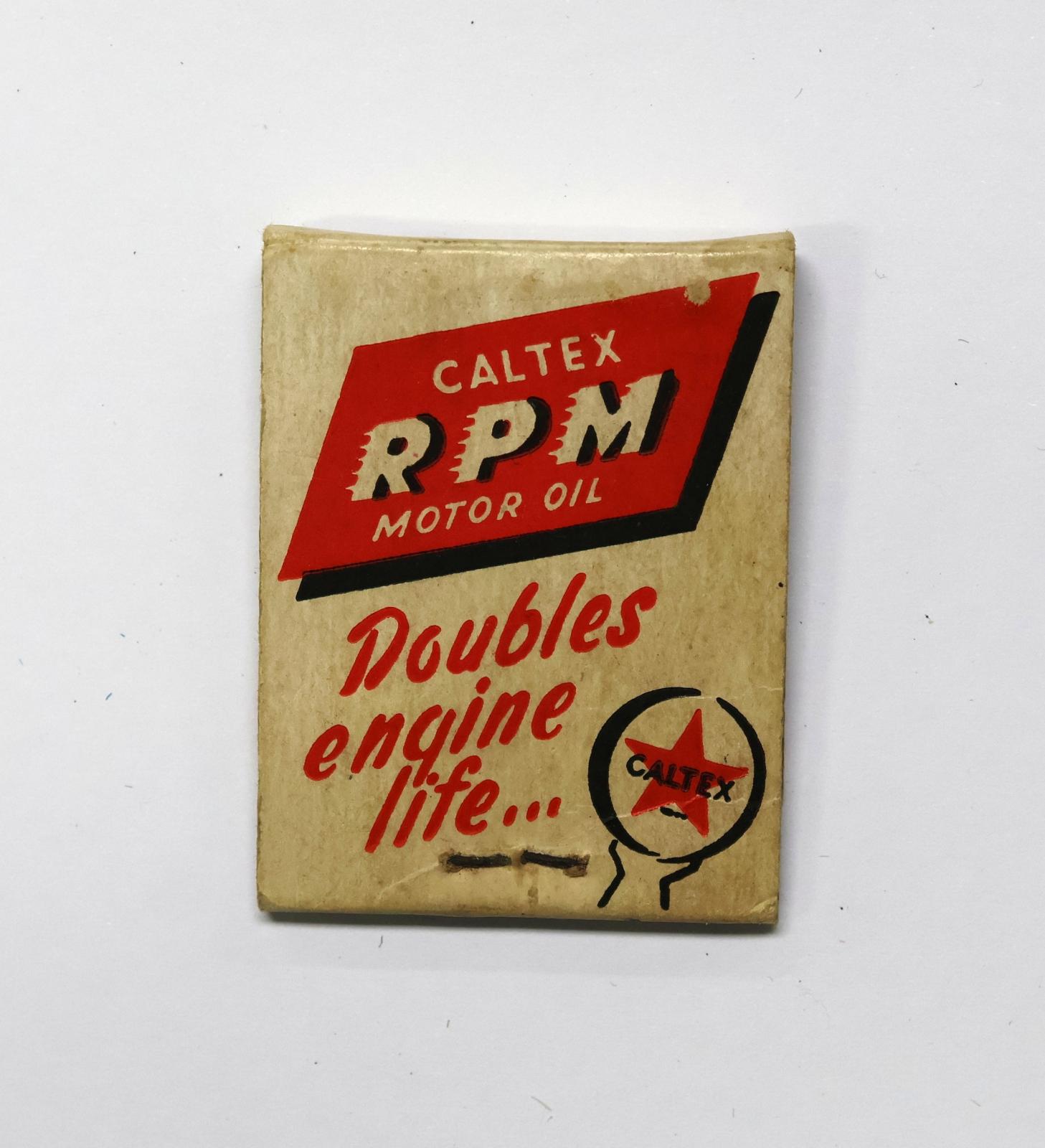 Rectangular shaped matchbook with white background and red, black and white text. 