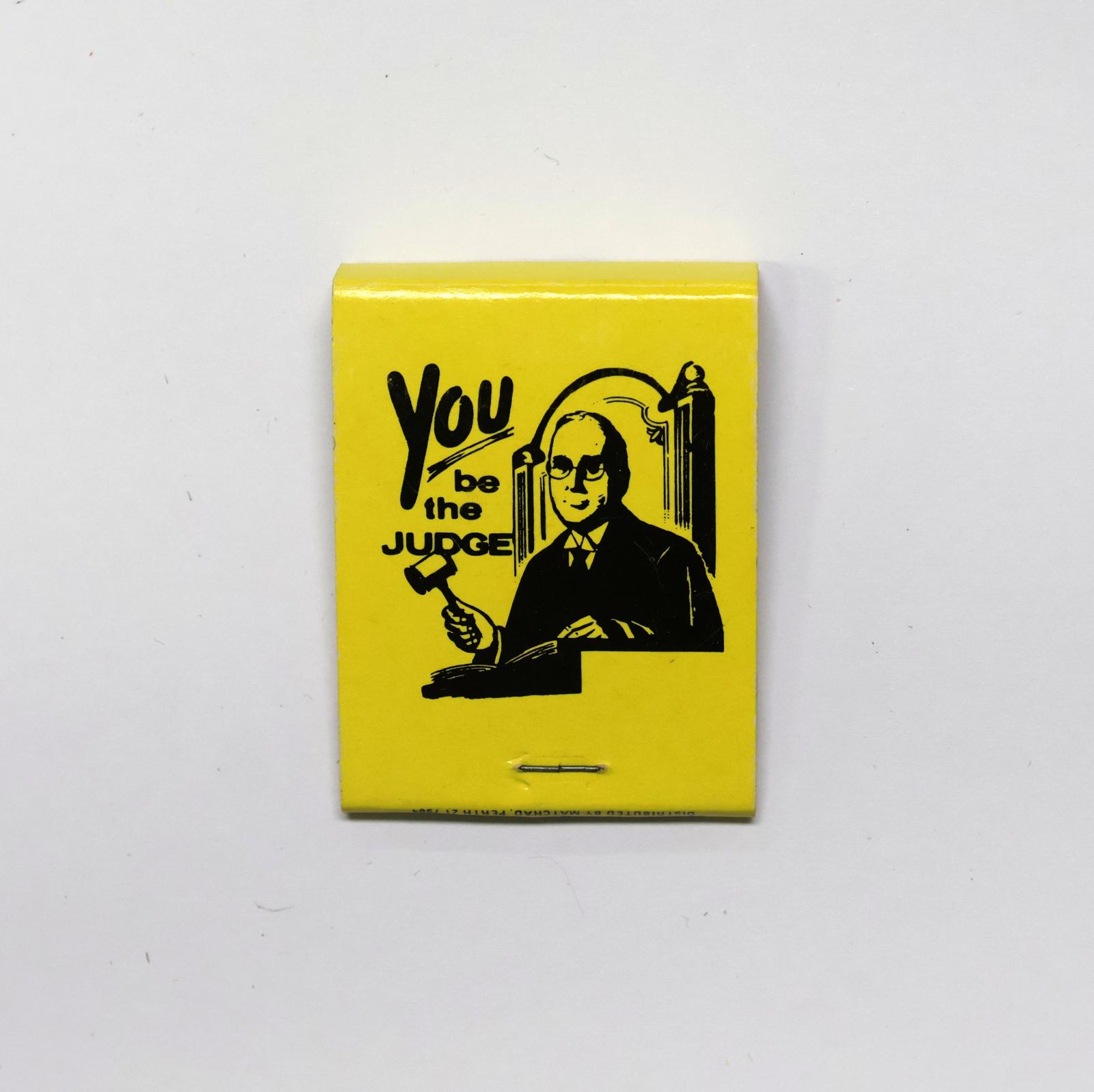 The back of the matchbook has an image of a judge with a gavel. 