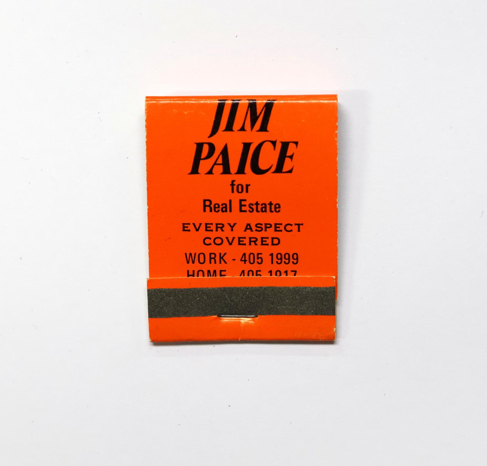 Rectangular shaped matchbook with orange background and black text.  The front of the matchbook has a grey igniting panel. 
