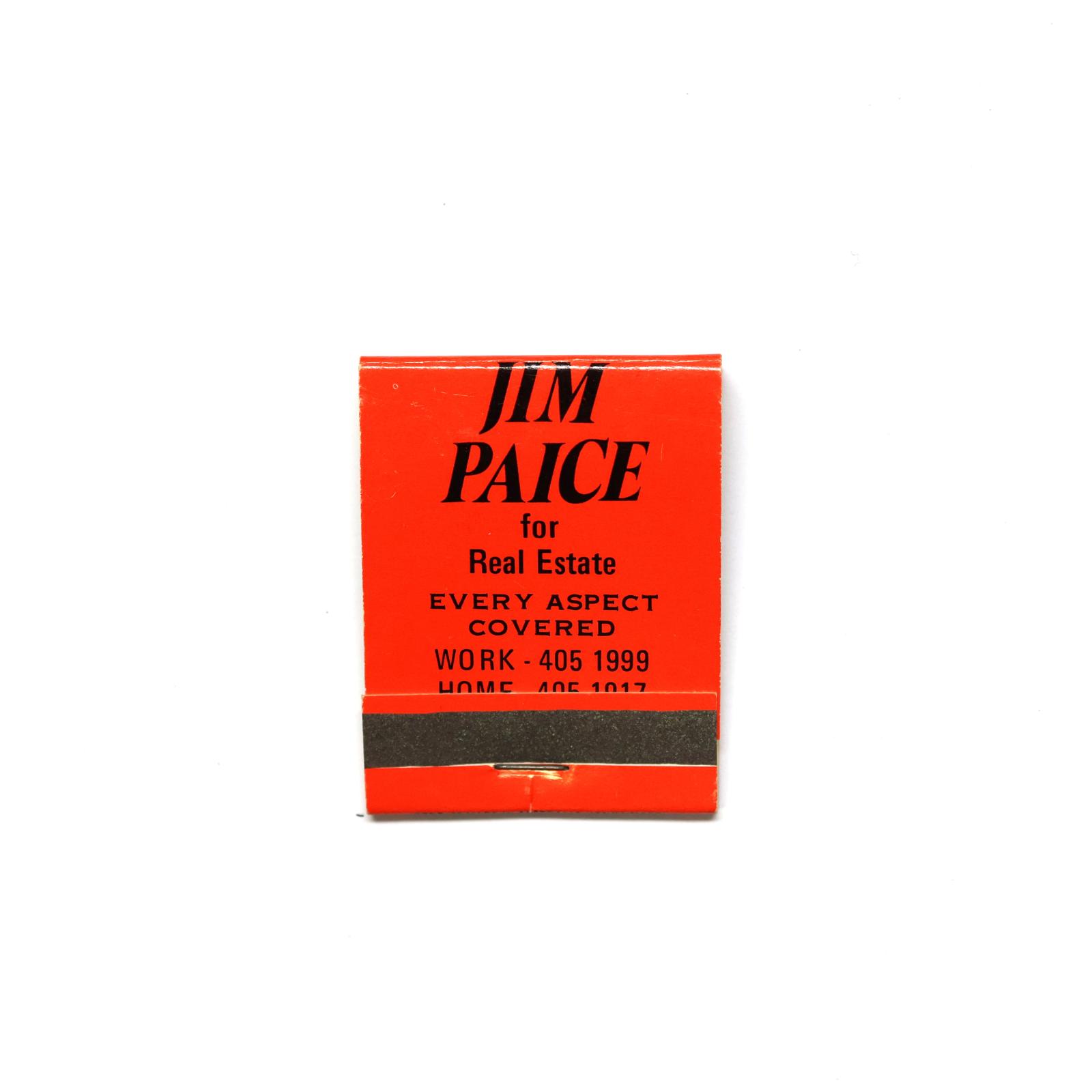 Rectangular shaped matchbook with red background and black text.  The front of the matchbook has a grey igniting panel.
