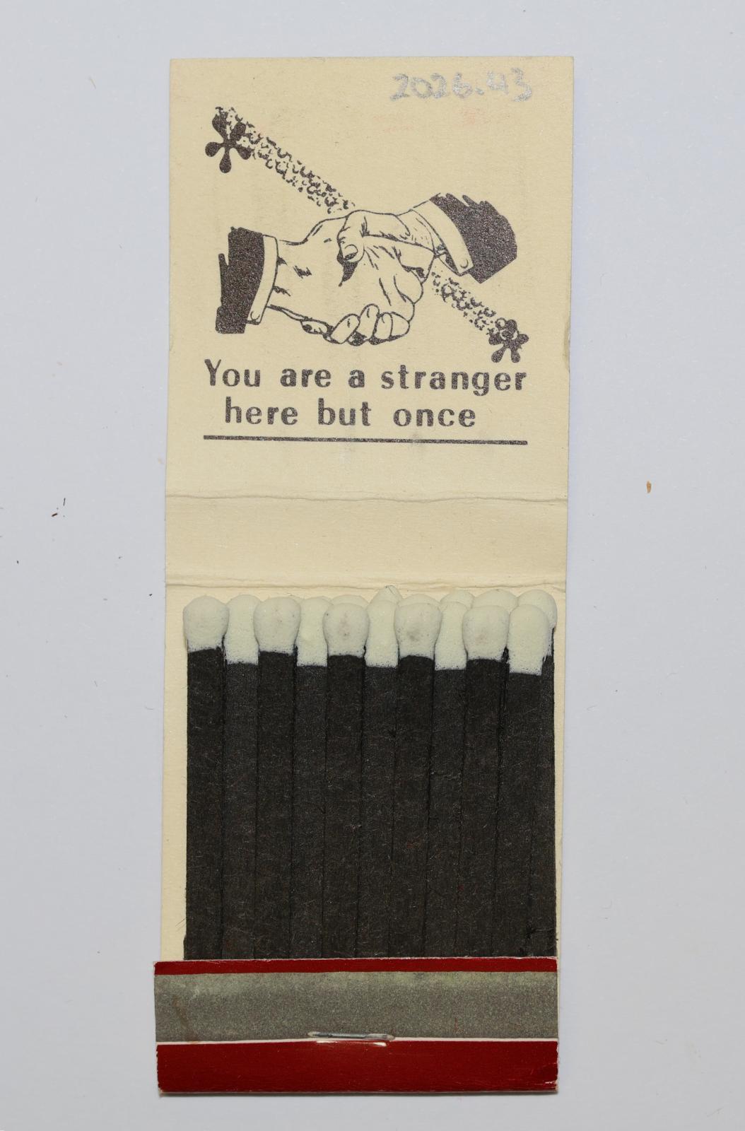 The inside has 20 black matchsticks with white match heads.