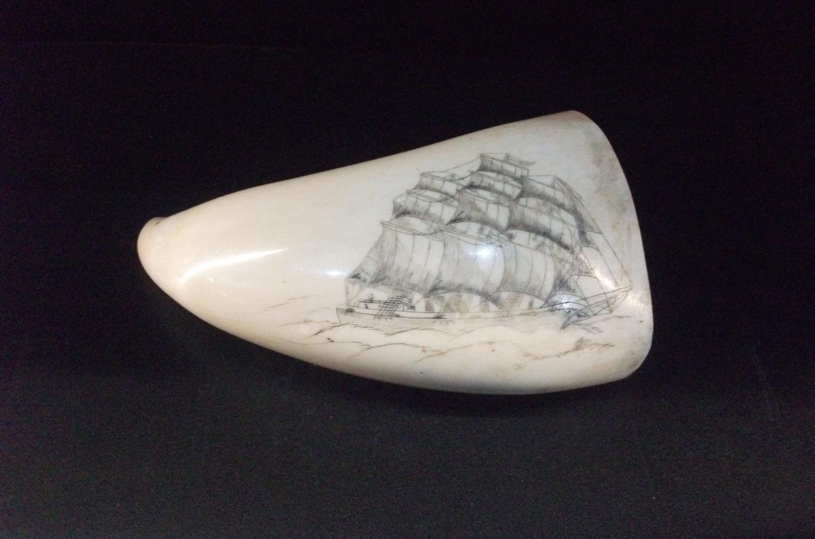 Scrimshawed whale tooth by CBWS captain depicting a historic sailing ship.