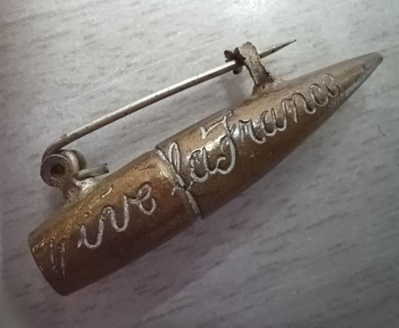 Bullet brooch