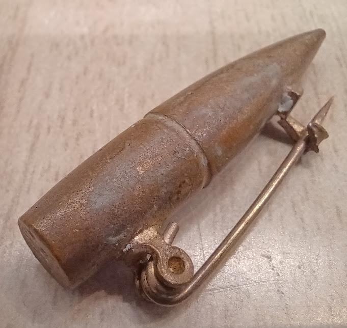 Bullet brooch