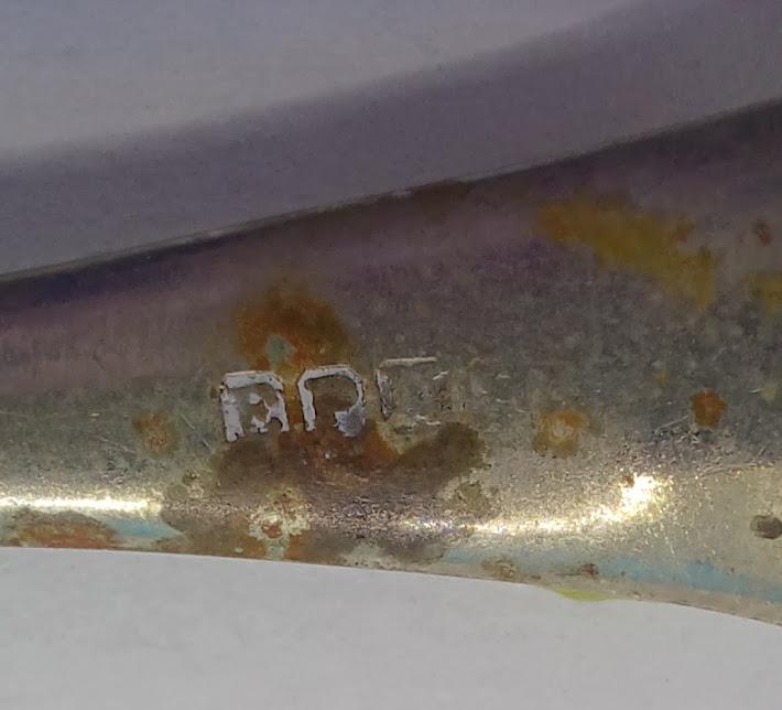 Markings on sugar sifter spoon