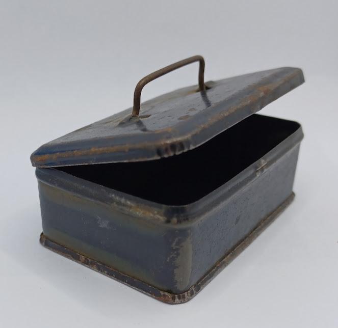 Small metal lidded container
