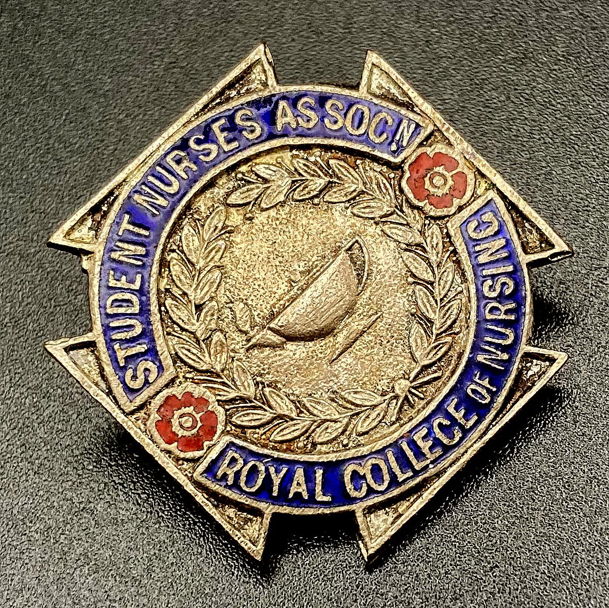 Angled view of Student Nurses Association Royal College of Nursing badge 
