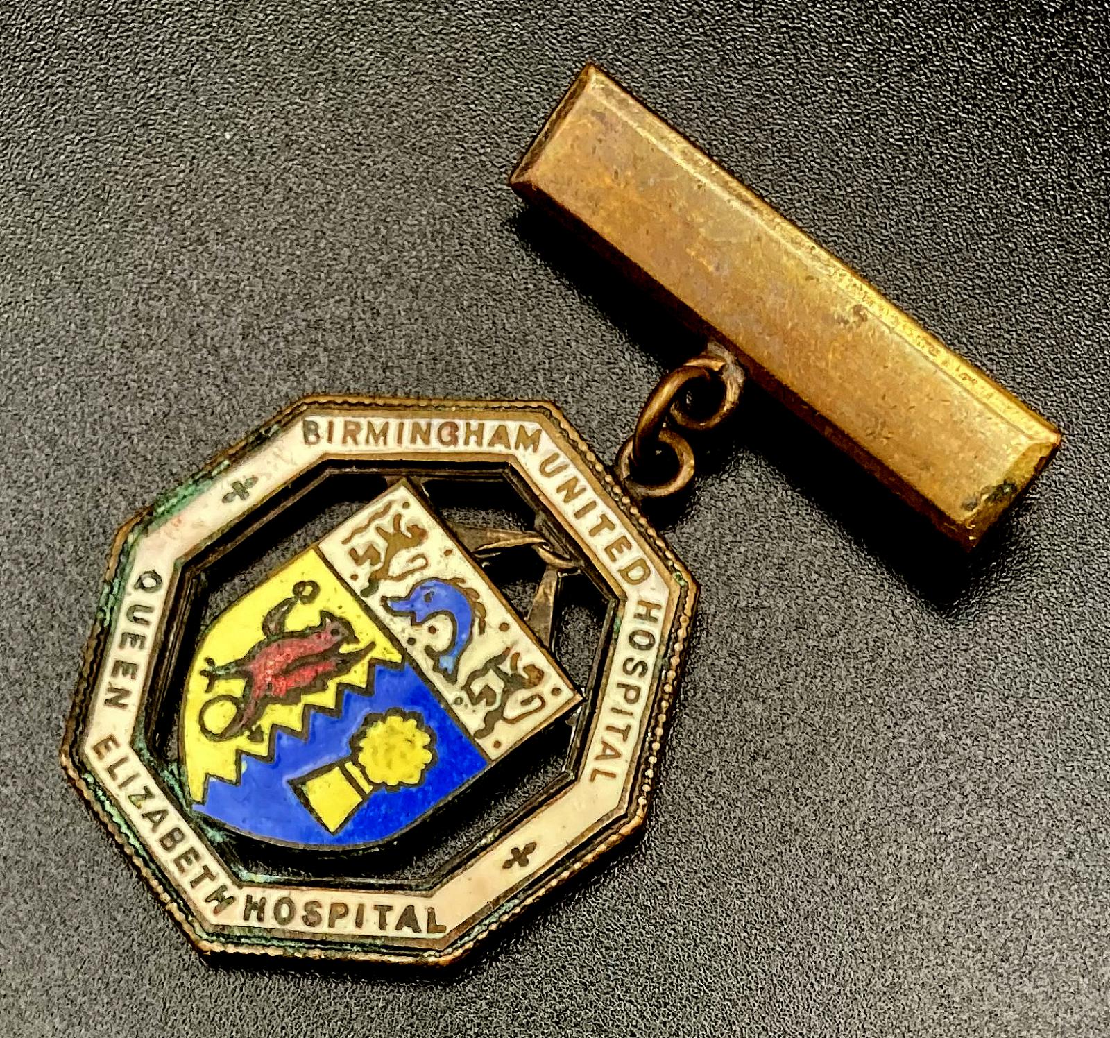 Other angled view of Birmingham United Hospital Queen Elizabeth Hospital badge presented to Nurse E.E. Webb